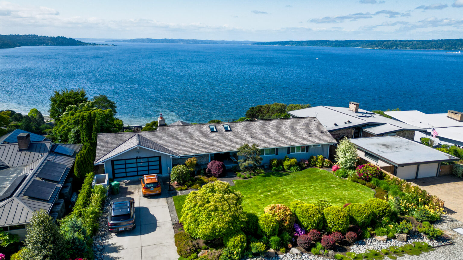 View of Home with Synthetic Shake Roof in Three Tree Point, Washington