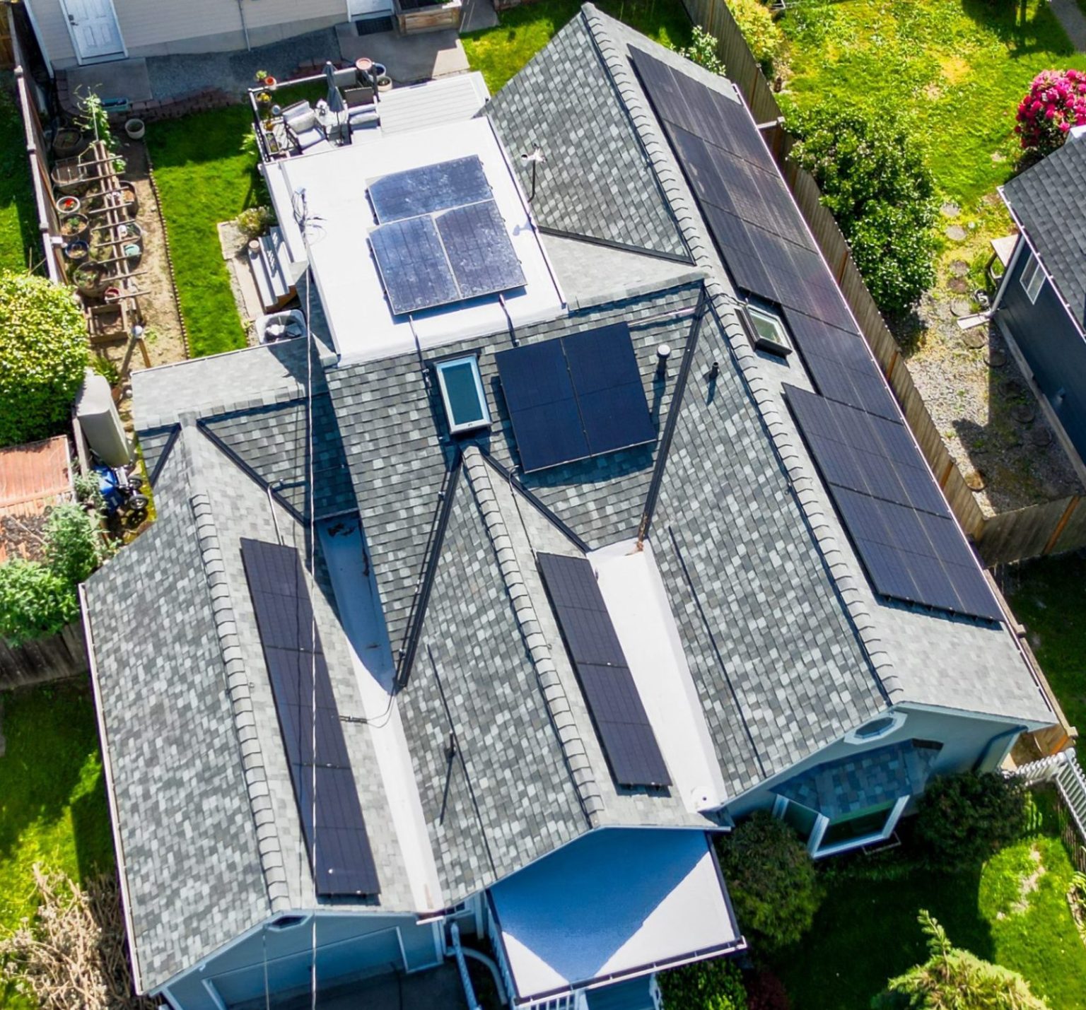 Overhead Close up View of Home with Composite Asphalt Shingles, TPO, and Solar in Renton, Washington