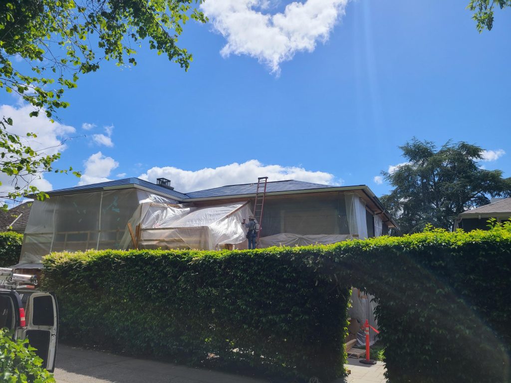 Street view of Tesla Solar Roof being installed