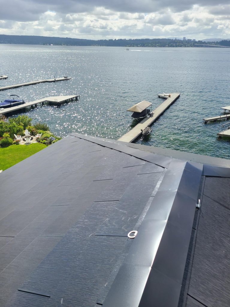 Close up view of Tesla Solar Roof tiles and ridgecap installed