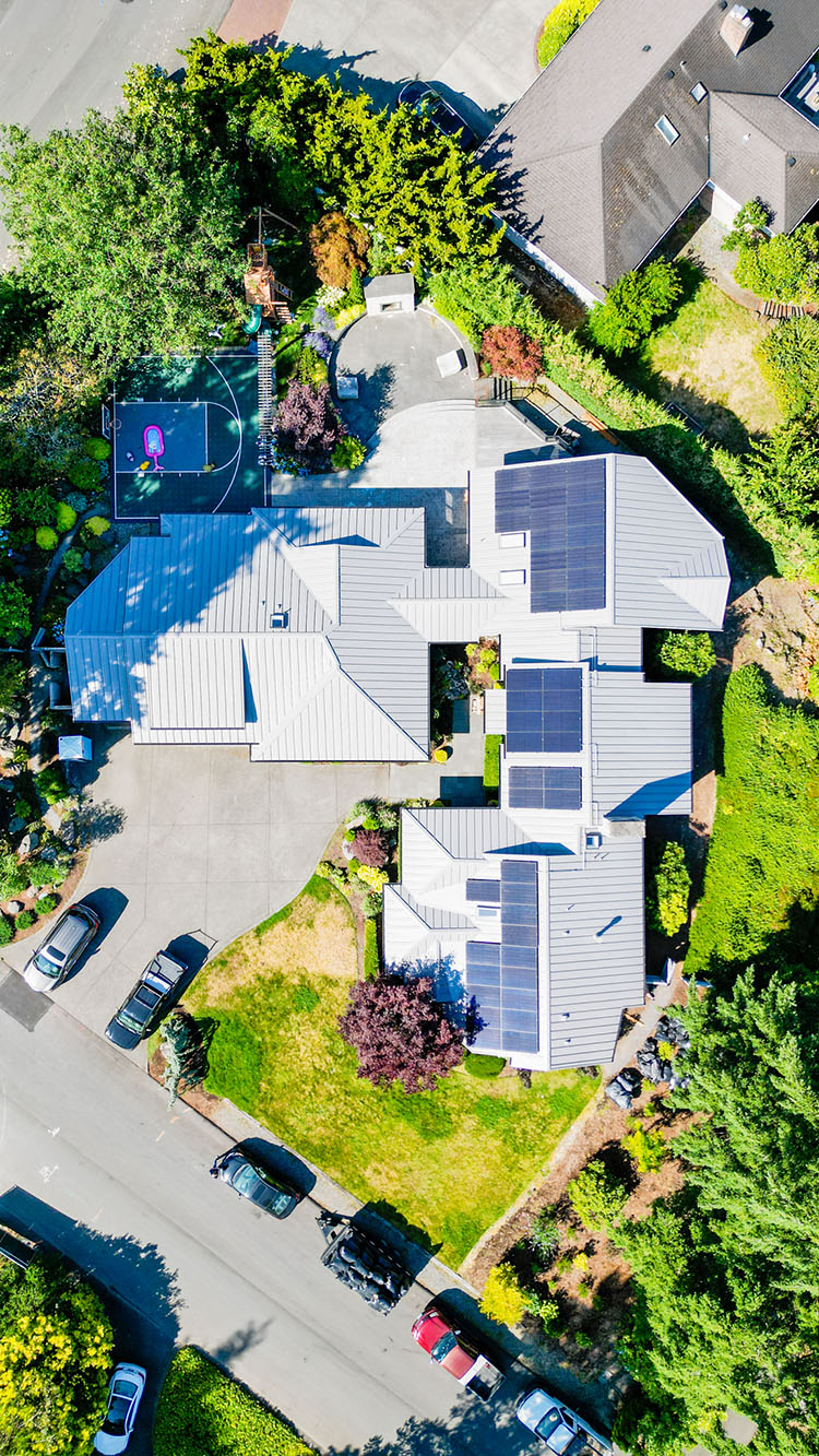 Overhead view of the home with the elegant Nu-Ray Metal Roof with solar panels in Clyde Hill, Washington.