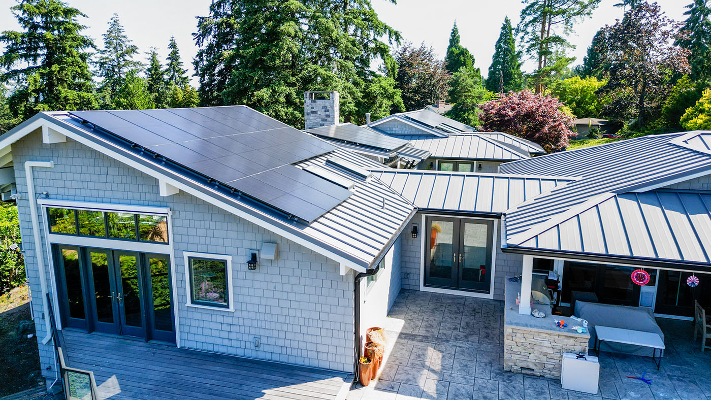 View from the back of the house of the Beautiful Nu-Ray Metal Roof with solar panels in Clyde Hill, Washington